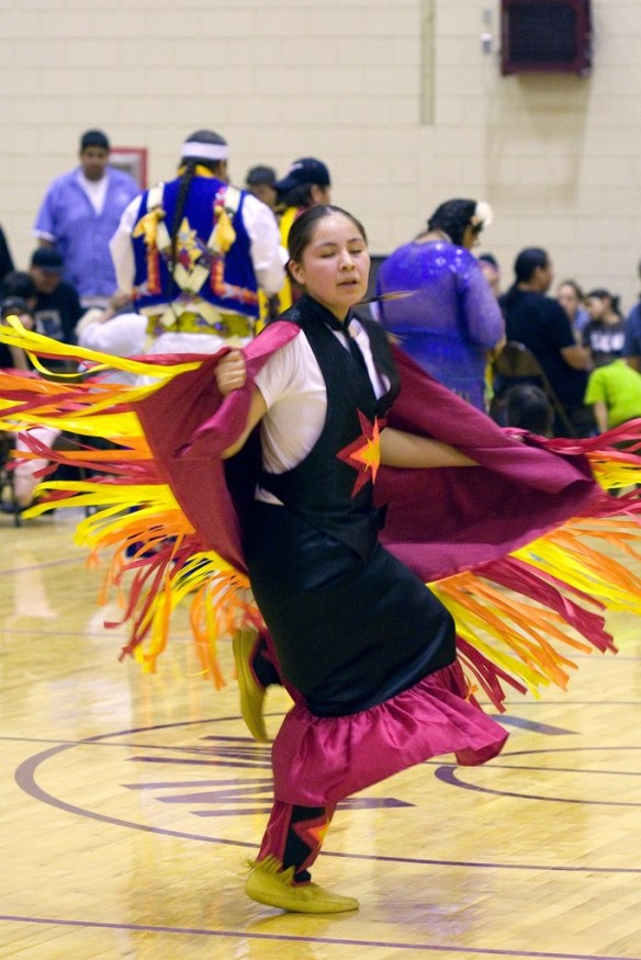 Fancy-dancing at UNM's Pit (courtesy Nic McPhee, Flikr Creative Commons)