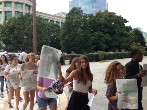 Upper School students marching with the NAACP to protest NC's restrictive new voting rights legislation